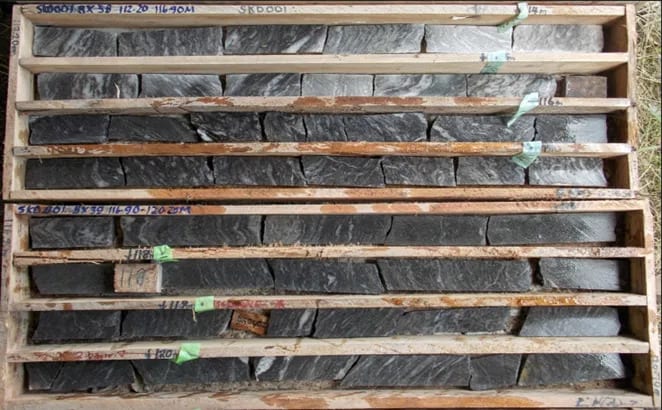 Example of historical drill core from SKD001 with highly deformed schist and ample quartz veining.